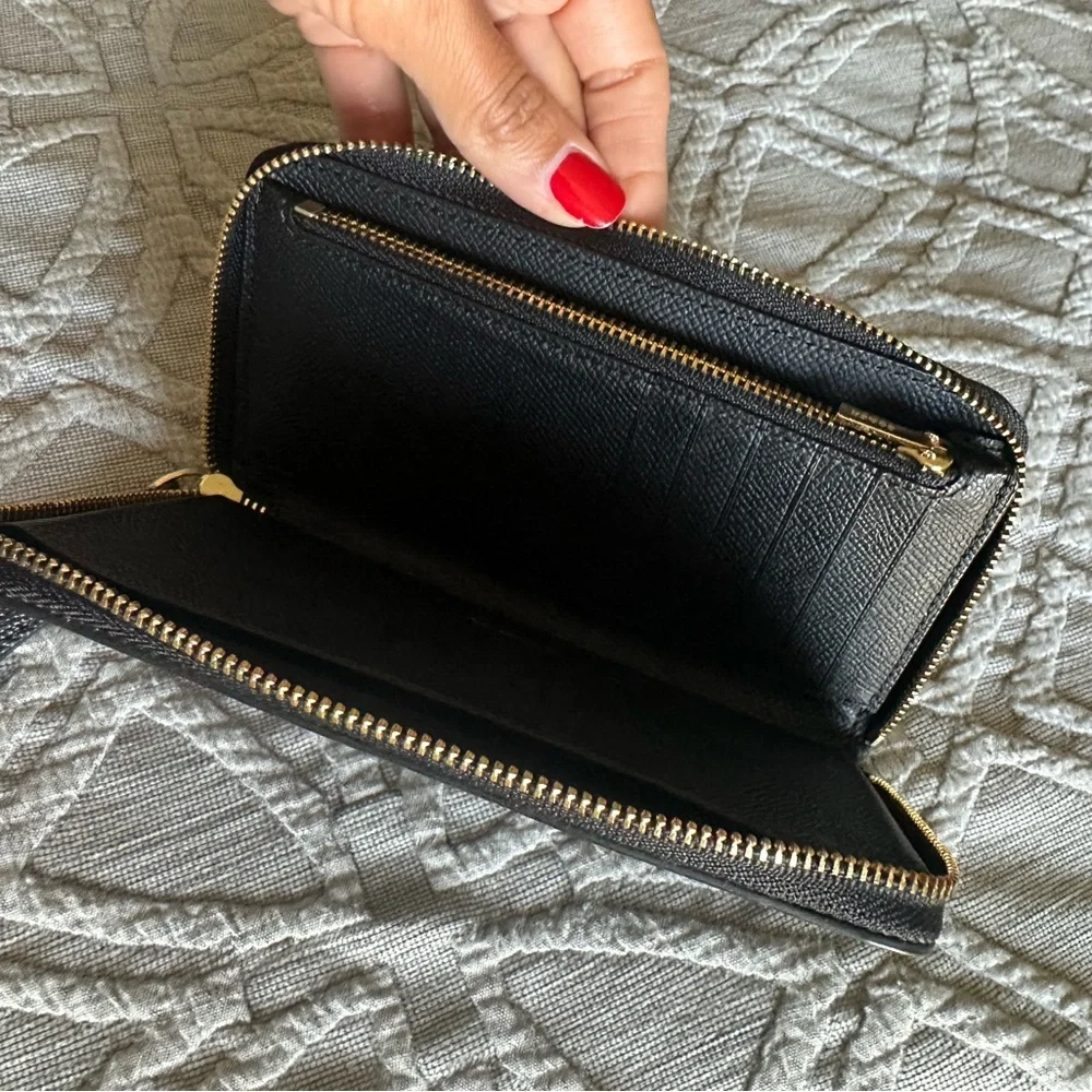 Coach wristlet zip around black pebble wallet